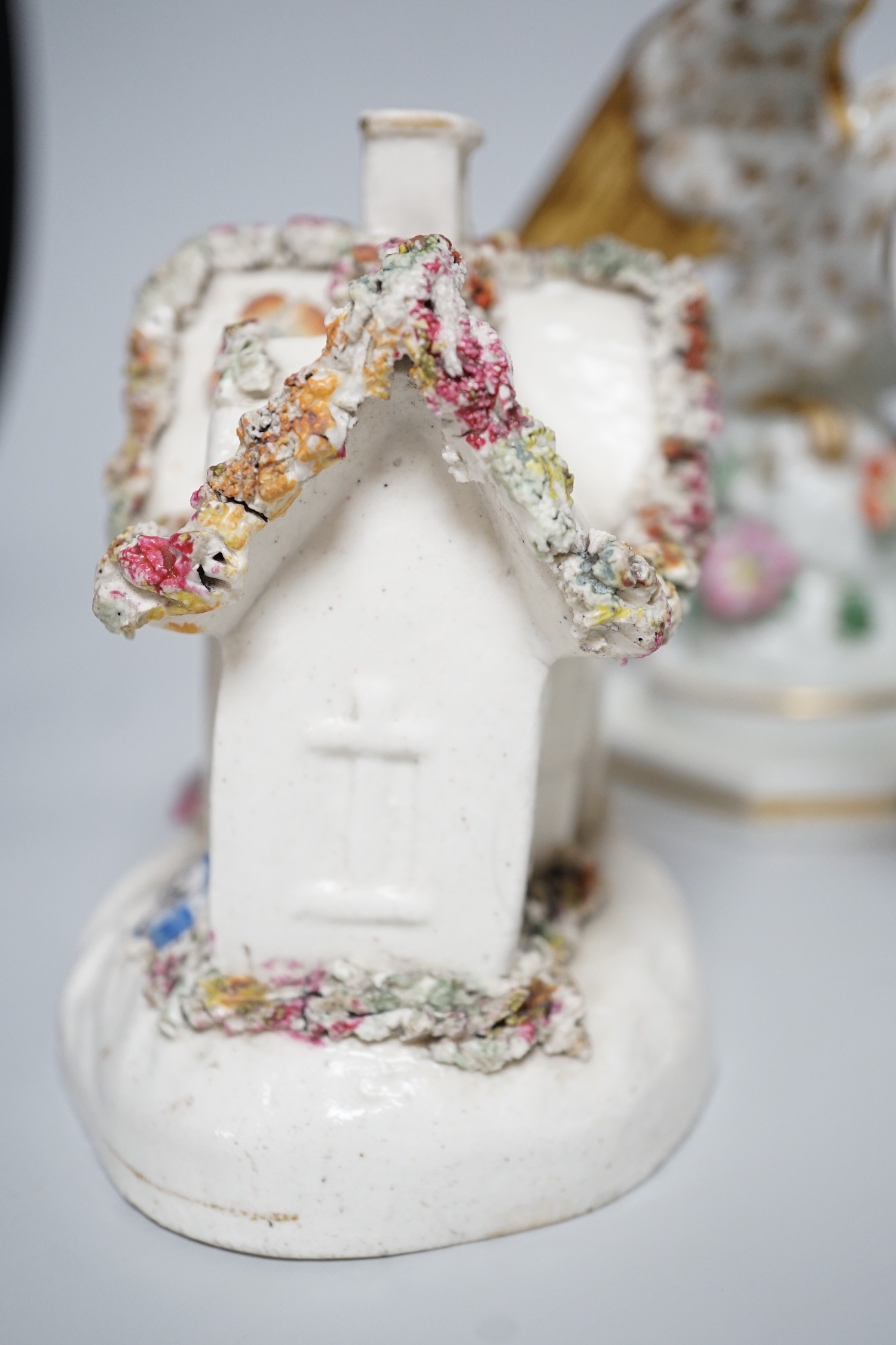 A Worcester milk jug, c.1780, a Newhall-type cream jug, c.1795, a Staffordshire porcelain model of an eagle, c.1830-40, 17cm high, and two Staffordshire porcellaneous models